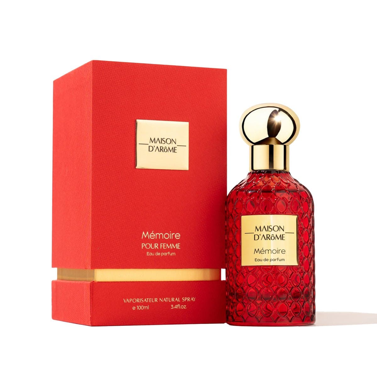 Memoire flacon beside its red presentation box