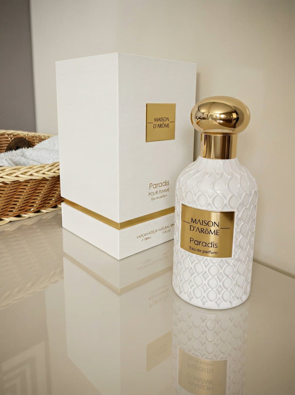 Paradis beside its white and gold presentation box